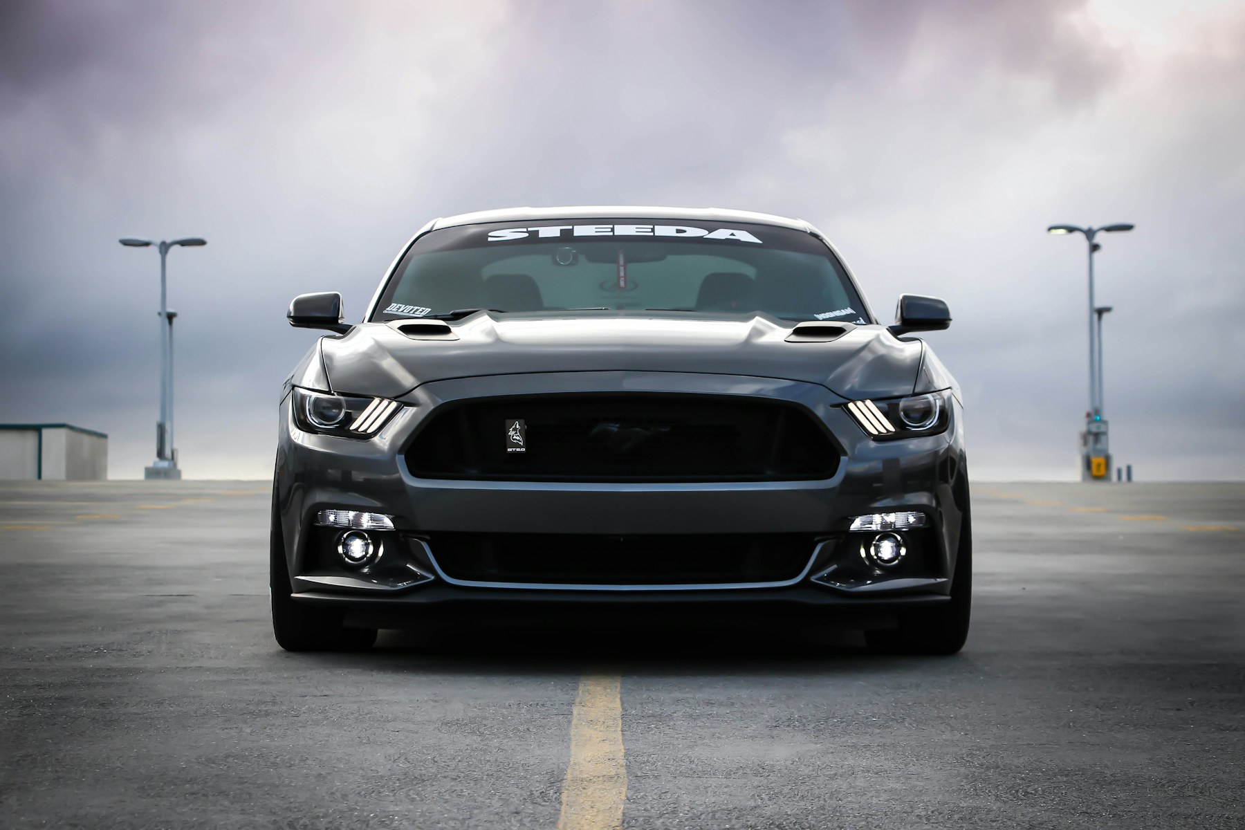 Dark sports car facing the camera